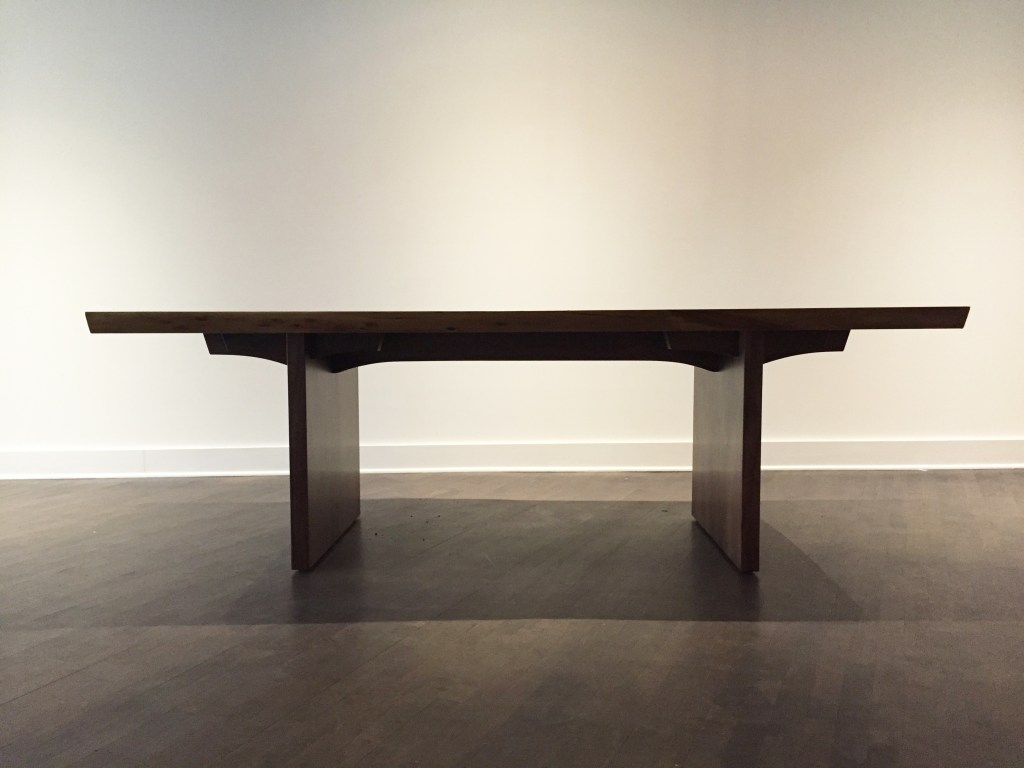 frontal view of a straight legged slab base with slab top and custom trestle