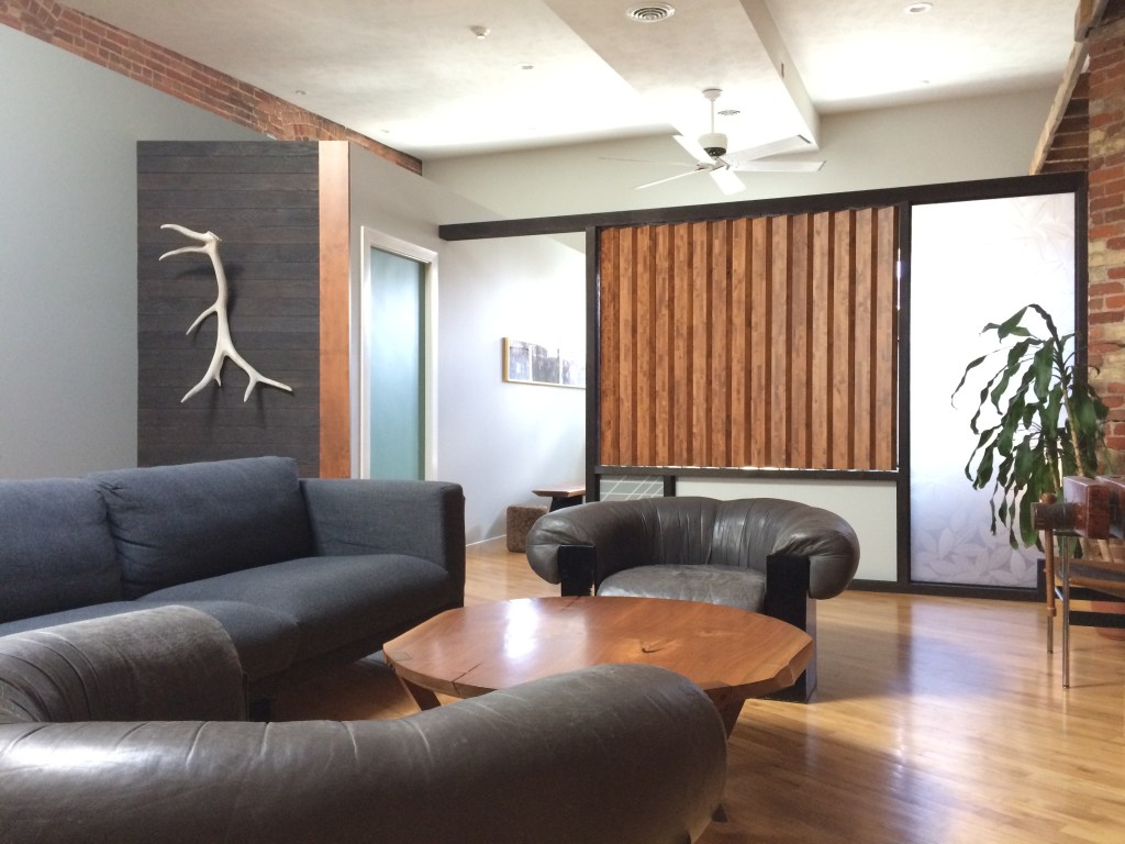 open loft design with burnt wood elements and other raw materials incorporated the home of Terrawood