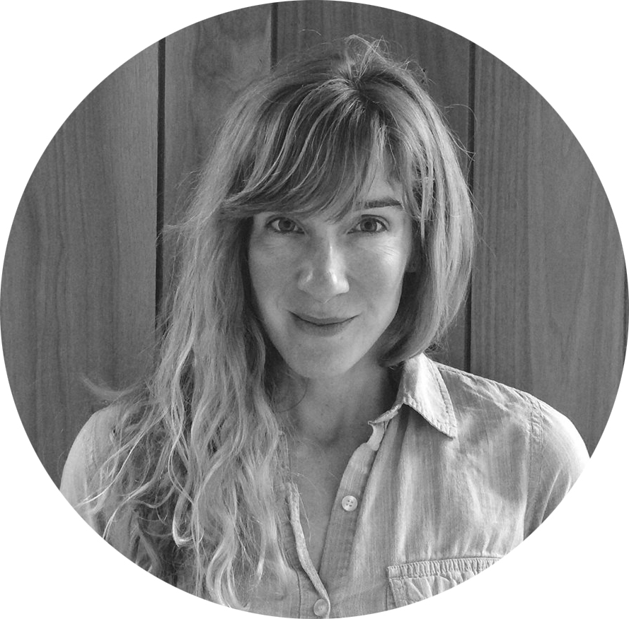 Woman with long hair against wooden background in black and grey