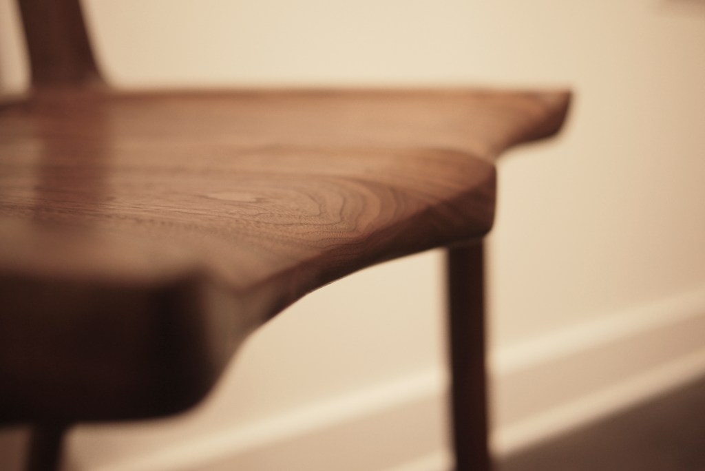 close up on shaped chair seat made of walnut by Terrawood design